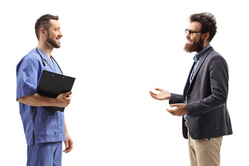 Wall Mural - Bearded man talking to a male doctor in a blue uniform