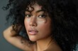 © Andrii Zastrozhnov - Elegant young woman with curly hair, attractive face, and flawless skin in a fashionable portrait.