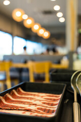 Wall Mural - Thinly sliced of raw pork for Japanese hot pot also known as Shabu Shabu or Sukiyaki is Japanese style.