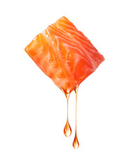 Wall Mural - Slice of salmon with falling fat drops close up isolated on a white background