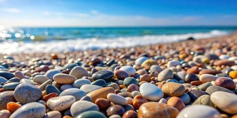 Wall Mural - Abstract background of round pebble stones on the beach for a vacation holiday concept, pebbles, stones, background, abstract