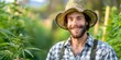 © Anastasiia - Proud marijuana farmer protecting his crop with a smile on his face. Concept Cannabis Cultivation, Farming Practices, Smiling Farmer, Crop Protection, Proud Harvester