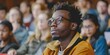 © Anastasiia - A Black student joins peers in college lecture. Concept Education, Diversity, Higher Learning, Student Life