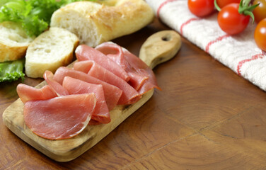 Poster - smoked ham of pork on a wooden board