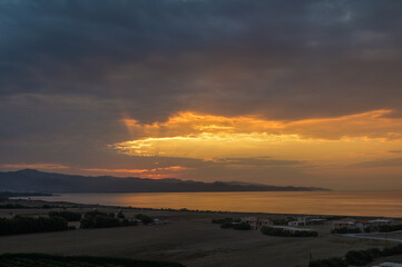 Wall Mural - Beautiful bright orange - yellow cloudy sky during the sunrise and sunset. 1