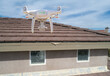 © Andy Dean - Quadcopter UAV Drone Flying A Residential Roof Inspection.