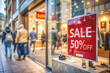 © photoagents - sale sign in shop window and sunset city street with people. Shopping concept