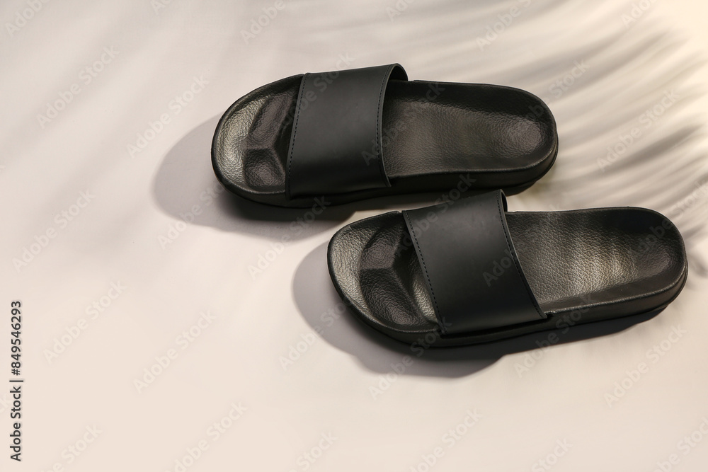 Female stylish flip flops on grey background