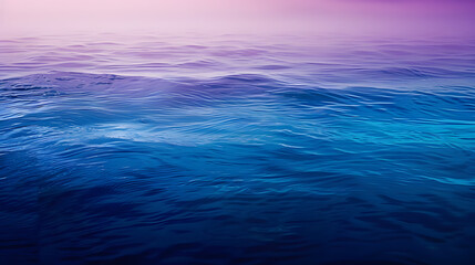 The ocean is calm and the sky is a beautiful shade of purple