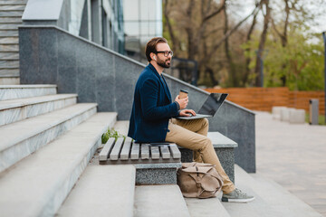 Wall Mural - handsome busy bearded man working in park