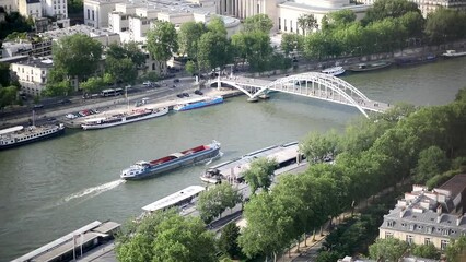 Wall Mural - Aerial scenic view of the river Seine, touristic boats and Passerelle Debilly in Paris, France.