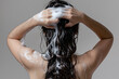 © SITI - Intimate Moment of a Young Woman Washing Her Curly Hair, Focusing on Personal Hygiene and Self-Care