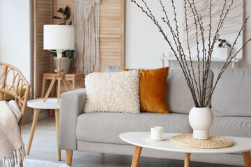 Wall Mural - Vase with willow branches and cup on table in living room