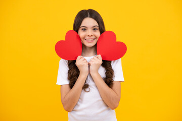 Poster - Happy teenager, positive and smiling emotions of teen girl on yellow background. Lovely child girl 12, 13, 14 years old with shape heart love holiday and valentine symbol. Valentine or birthday day.