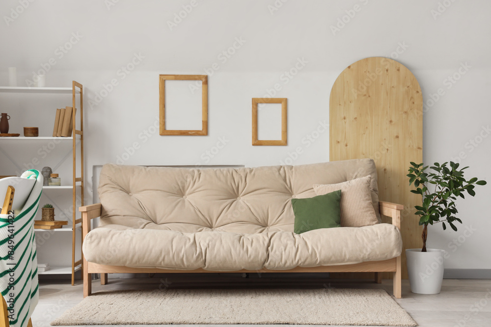 Interior of living room with sofa and frames