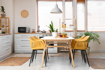 Wall Mural - Interior of stylish kitchen with dining table, chairs and lamp