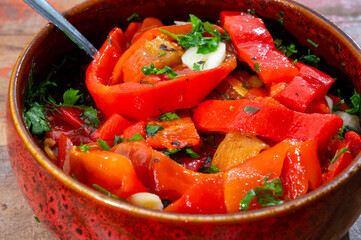 Wall Mural - Grilled red peppers, sweet paprika salade with fresh garlic and parsley