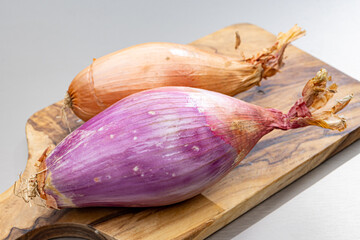 Sticker - French long pink shallots grappe onion from Brittany, France close up