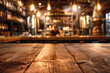 © grey - A wooden bar top in the foreground with a blurred background of a brewery tasting room. The background includes large brewing tanks, shelves with various craft beers.