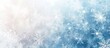 © Enigma - Step into a serene winter wonderland with delicate snowflakes falling against a dreamy blue and white backdrop. Perfect for holiday projects. Create a stunning visual experience with this snowy scene