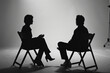 © KirKam - Silhouetted interview setup featuring two individuals on director chairs, creating a focused and dramatic discussion scene.