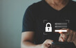 © THAWEERAT - User presses login and password on smartphone virtual screen. Cyber security, information security and encryption, secure access to user's personal information, secure Internet access, cybersecurity.