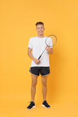 Sticker - Young man with badminton racket on orange background