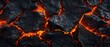 © Mentari - Lava texture background. Hot glowing lava closeup background, black orange heat design, top view. Abstract background of extinct lava with red gaps.