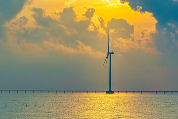 Wall Mural - windmill park with clouds and a blue sky, wind mill turbines in the ocean aerial view of a wind farm