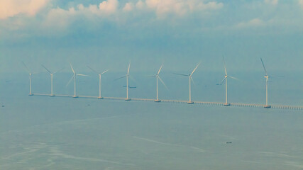 Wall Mural - panoramic view of wind farm or wind park, with high wind turbines for generation electricity with co