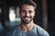 © Ai - Portrait of a smiling young man in sportswear looking at camera