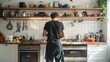 © Lens Legacy - A person stands with their back towards the camera in a well-equipped modern kitchen with various utensils and plants