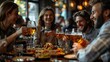 © MUCHIB - Friends Enjoying a Meal and Drinks at a Restaurant