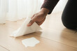 © Towfiqu Barbhuiya  - A man's hand washing the floor with a tissue