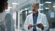 © kardaska - Two medical professionals discussing work