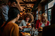 © La Famiglia - Waiter serving food to a group of customers at a restaurant