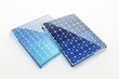 © Ева Поликарпова - A pair of solar panels placed on a clean and bright white surface, suitable for use in educational or commercial settings