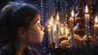 © Farid - Child girl Looking at Menorah Candles on wooden table and sufganiyot on background light glitter bokeh overlay. Hanukkah jewish holiday Israel hebrew traditional family celebration invitation design.