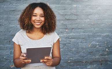 Portrait, smile and tablet with developer black woman on brick wall background for creative research. Internet, project management and space with happy employee outdoor for professional web design