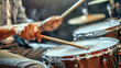 © redflower - Drummer’s Hands Using Sticks on Drum Kit