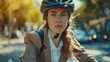 © Barosanu - Focused woman wearing a bike helmet cycles through city traffic during daylight