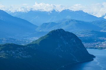 Wall Mural - The mountains and the landscape of lake Lugano, during a spring day, near the town of Brusino Arsizio, Switzerland - May 25, 2024.