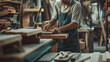 © redflower - Close-Up of Craftsman at Work in Small Furniture Manufacturing