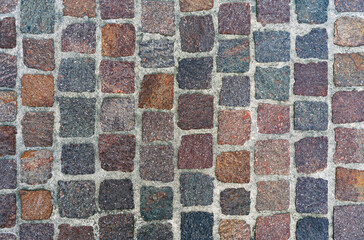 Wall Mural - Stone pavement texture from red granite cubes, cobblestone street background top view