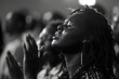 © john - a group of black people worshipping, praising, in the church, hand up, praying and singing, black and white