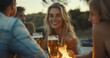 © SerPhoto - A group of happy friends drinking beer on a picnic in the summer.