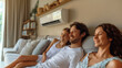 © AS Photo Family - Happy Family Relaxing Together Under Air Conditioner at Home