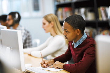 Poster - Writing, notes and college student at computer in library for university education, online course or project research. Reading, studying and man with notebook for web exam, elearning and planning.