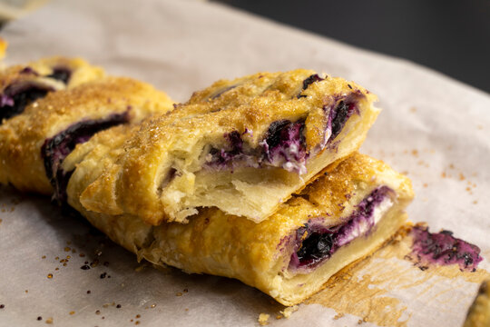 puff pastry dough with blueberries on a black background. dessert. food concept diet