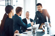 © peopleimages.com - Men, handshake and introduction for meeting at office with smile for welcome, deal and respect. Business people, shaking hands and happy with diversity, collaboration and onboarding for job at agency